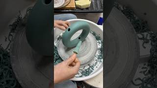 Trimming and altering to make a green stoneware circle vase