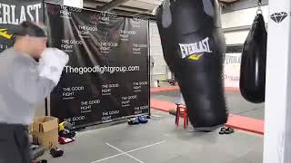 Dustin Porrier Works on a Bag in His Gym