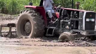 Tractor Plowing Through Tough Mud