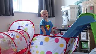 Playing in my new ball pit and slide