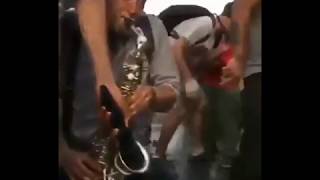 Playing a saxophone in the middle of a protest in Chile