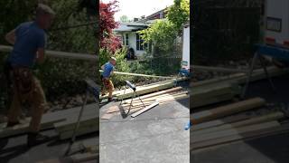 How to lift a heavy deck board onto sawhorses efficiently