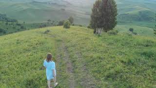 Woman in blue dress in Altai mountain