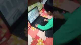 A kid playing game on laptop #game #kids #kidsvideo