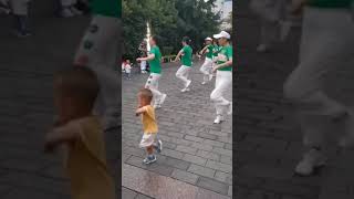 This Toddler dancing with the group