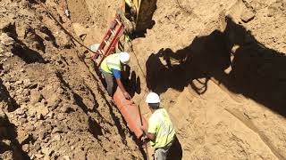 Construction  Installation of 12 inch Vitrified Clay Pipe in Class D native soil bedding