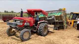 Arjun 555 Di Tractor filled with soil overturned, it was saved with great difficulty from the JCB