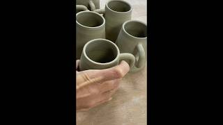 Trimming and adding handles to a batch of espresso cups