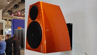 Meridian DSP3200 loudspeakers in a striking Volcanic Orange colour.