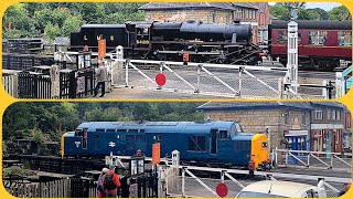 Steam loco and heritage diesel on level crossing at Grosmont, NYMR