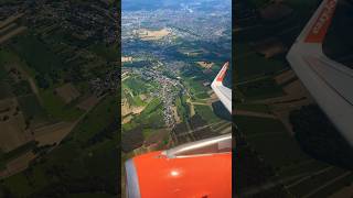 Airbus A320 neo Flying over Basel Switzerland Takeoff with great view to the City