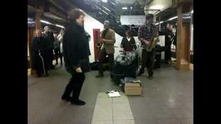 Woman dancing in New York Subway