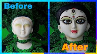 Eyes painting on clay idol.