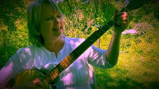 Cary Fridley plays the banjo and sings I've Endured