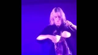 Billie Eilish wearing fan's bra on stage