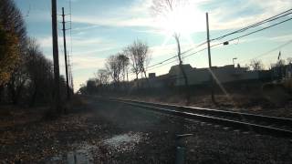 Another eastbound LIRR train flies through Farmingdale NY.