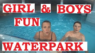 Girl And Boys Fun In Waterpark On Water Slides