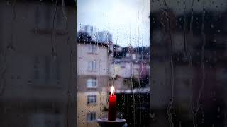 Rain outside the window. A candle is burning. ASMR #SHORTS