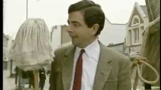 Mr Bean driving on roof of a car