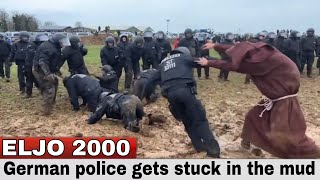 German police get stuck in the mud at coal mine protest