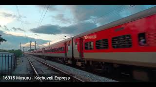 Train departing under dramatic sky | 16315 Mysuru - Kochuveli Express