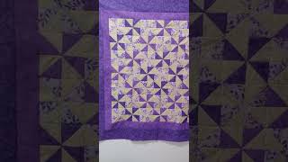 Sew & Tell purple pinwheels wall hanging.