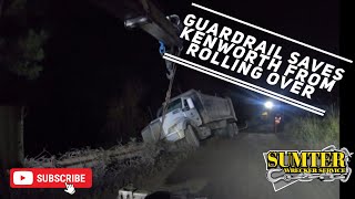 Guardrail saves Kenworth from rolling over