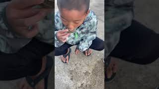 Nephew trying a raw oyster!