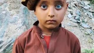 A little Afghan boy with two different coloured eyes