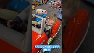 Grumpy baby driving at Chuck E. Cheese