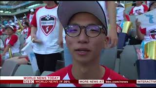 North and South Korean workers play football match