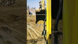 Excavator dredging water trench satisfying work