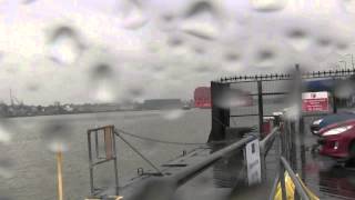 Ships in heavy rain From Tilbury Ferry Essex