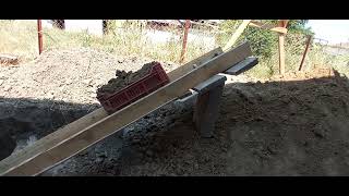 Digging deep hole by hand and winch conveyor line