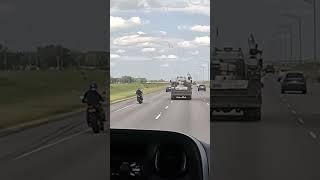 Motorcyclist cut off by truck.