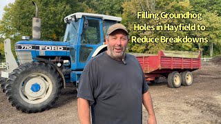 Filling Groundhog Holes Using Off-Road Dump Trailer and Ford 7710 Tractor to Reduce Breakdowns