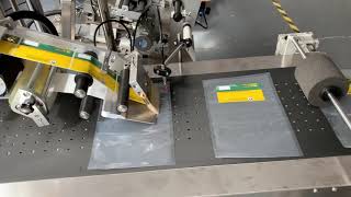 Plastic bags labeler machine working video