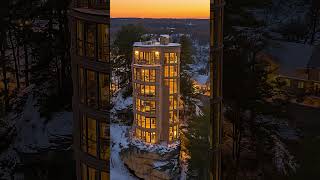 Stunning Night View: Towering Illuminated Cliff Building in Snowy Landscape 🌙✨ #modernexterior