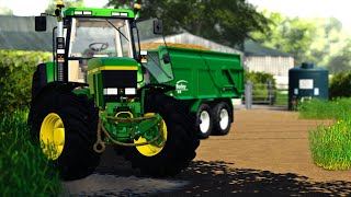 Carting dung with a John Deere 7810