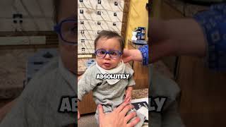 The baby tries on glasses for the first time 😲