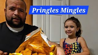 Dad and daughter trying out Pringles Mingles