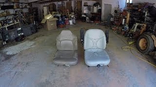 Installing a suspension seat in a skid steer.