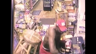 Small Elderly Clerk Squares Off Built Robber With Stool