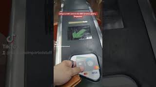 Using a credit card to get on the MRT (metro) in Singapore