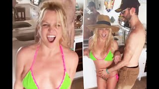 Britney Spears is ringless again as she dances in tiny bikini with pal