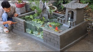 Design an aquarium at home with a beautiful mountain house built of cement and sand