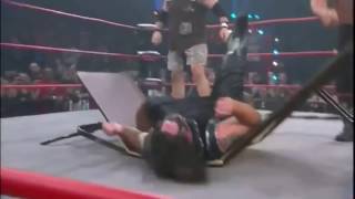 Double Chokeslam on Abyss through a Table