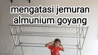 mengatasi jemuran almunium goyang