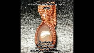 moonstone cabochon in copper wrap