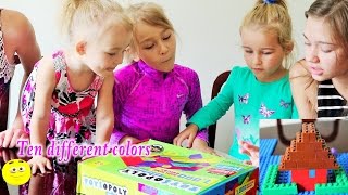 See excited kids Unpacking A BIG box of building blocks like LEGO ToysOpoly Building Bricks